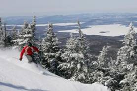 Skiing on Saddleback Mountain overlooking Rangley Lakes, Maine